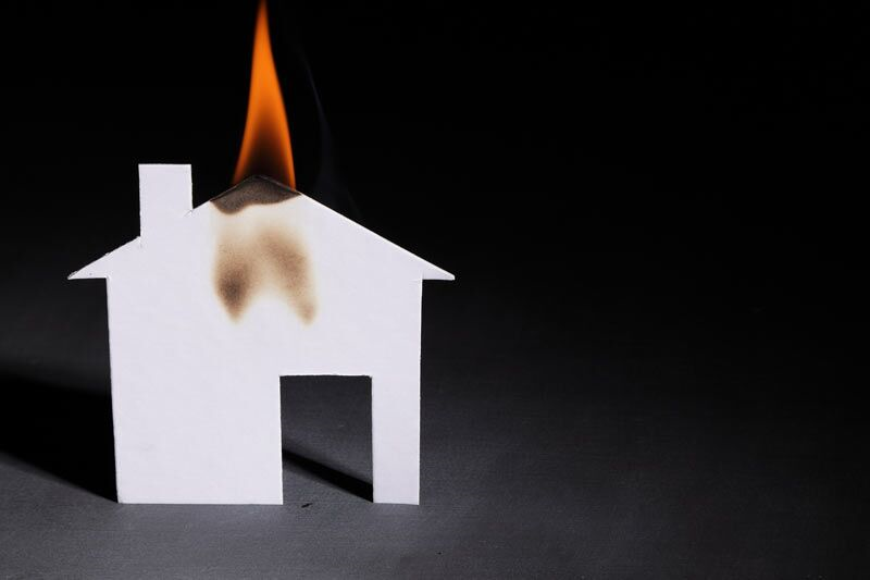 paper home cutout on fire